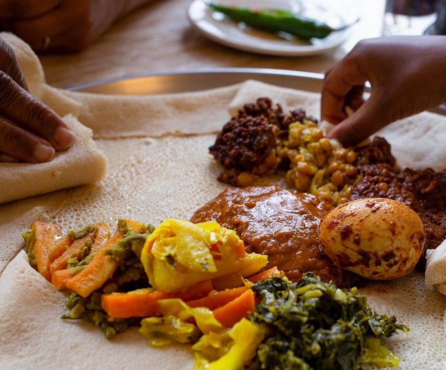 Vegetarian injera meal, with shiro, lentils, egg and a variety of vegetables